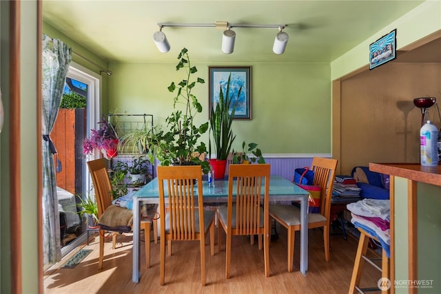12421 2nd Ave S, Seattle, WA 98168 - dining room featuring wood finished floors, wainscoting, and track lighting