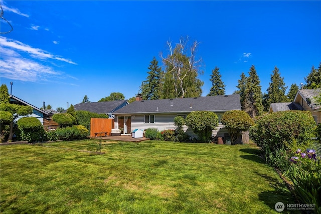 12421 2nd Ave S, Seattle, WA 98168 - rear view of house featuring a patio, a lawn, and a chimney