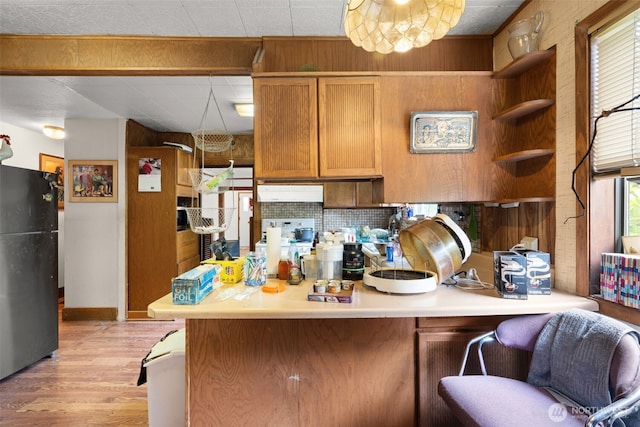 3626 E J St, Tacoma, WA 98404 - kitchen featuring freestanding refrigerator, open shelves, a peninsula, light wood-style floors, and light countertops
