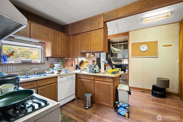 3626 E J St, Tacoma, WA 98404 - kitchen with white appliances, a sink, wood finished floors, and light countertops