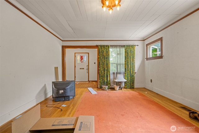 3626 E J St, Tacoma, WA 98404 - living room featuring ornamental molding, wood finished floors, and baseboards