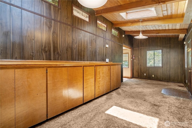3626 E J St, Tacoma, WA 98404 - interior space featuring a wood ceiling with exposed beams, wood walls, a skylight, and carpet