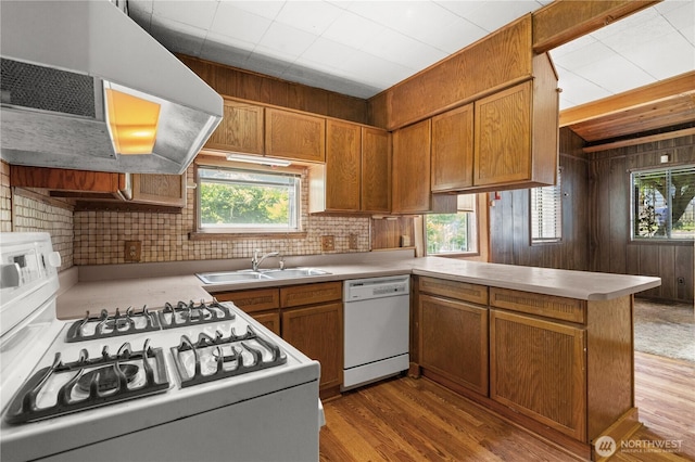 3626 E J St, Tacoma, WA 98404 - kitchen with white appliances, ventilation hood, healthy amount of natural light, a peninsula, and wooden walls