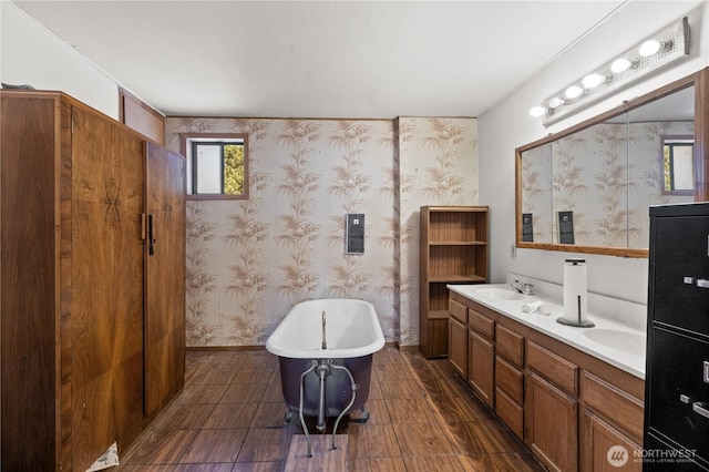 3626 E J St, Tacoma, WA 98404 - bathroom with a freestanding bath, wallpapered walls, and double vanity