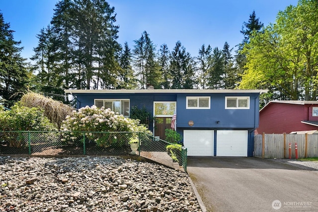 8824 224th St SW, Edmonds, WA 98026 - view of front of house with asphalt driveway and a garage