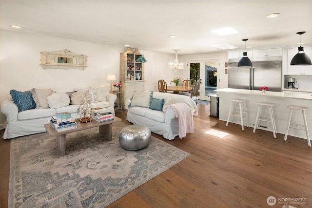 8824 224th St SW, Edmonds, WA 98026 - living room with wood finished floors, a chandelier, and recessed lighting