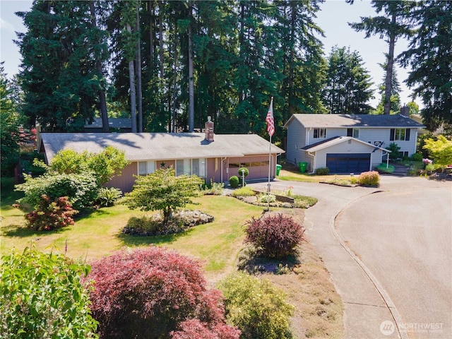 2623 25th Ct SW, Olympia, WA 98512 - view of front of property featuring a chimney, an attached garage, and concrete driveway