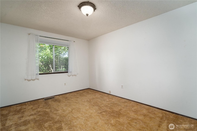 2623 25th Ct SW, Olympia, WA 98512 - spare room with carpet floors, a textured ceiling, and baseboards