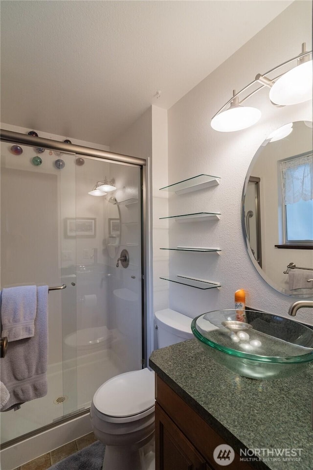 2623 25th Ct SW, Olympia, WA 98512 - full bath with a stall shower, vanity, and toilet