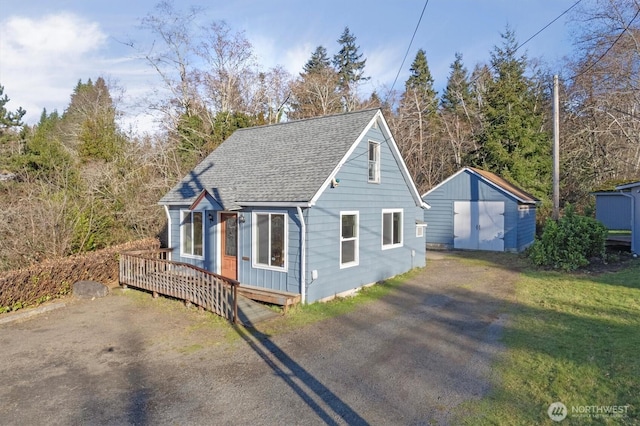 325 E State Route 4, Cathlamet, WA 98612 - view of front facade with a deck, driveway, and roof with shingles