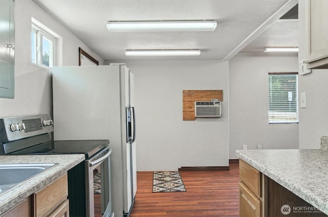 325 E State Route 4, Cathlamet, WA 98612 - kitchen with stainless steel electric range oven, dark wood-style floors, light countertops, and plenty of natural light