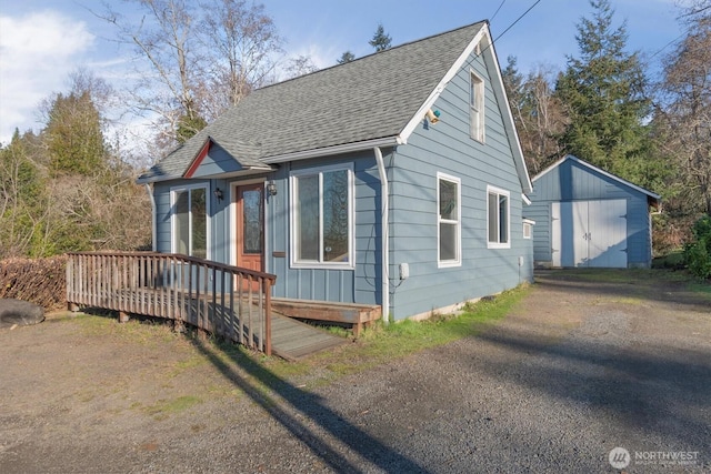 325 E State Route 4, Cathlamet, WA 98612 - view of front facade featuring a shingled roof and a wooden deck