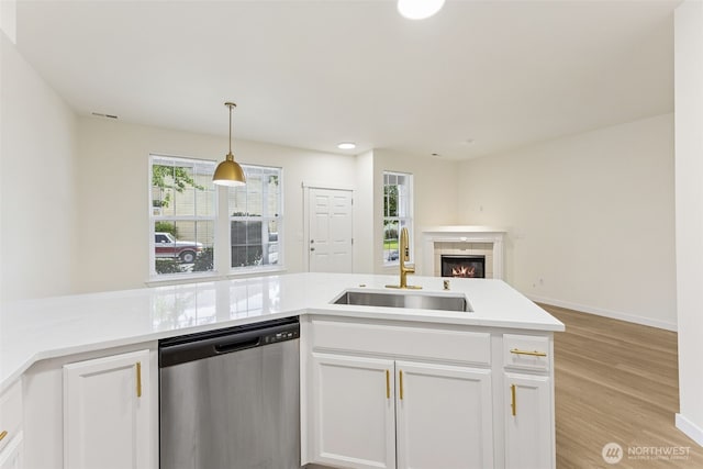 717 115th St E, Tacoma, WA 98445 - kitchen featuring stainless steel dishwasher, open floor plan, white cabinets, light countertops, and recessed lighting