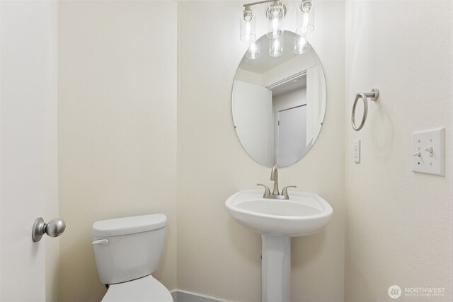 717 115th St E, Tacoma, WA 98445 - half bathroom with toilet and a sink