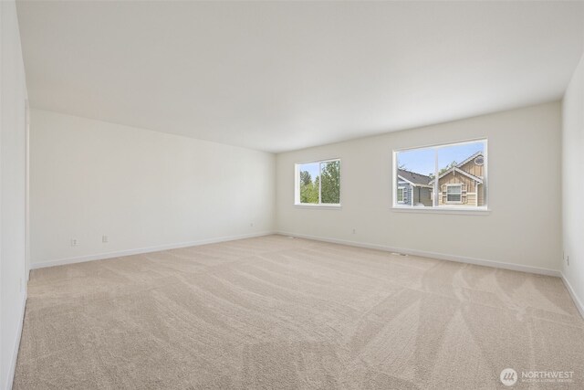 717 115th St E, Tacoma, WA 98445 - empty room with light colored carpet