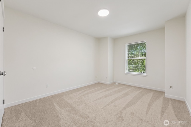 717 115th St E, Tacoma, WA 98445 - spare room with light carpet and baseboards