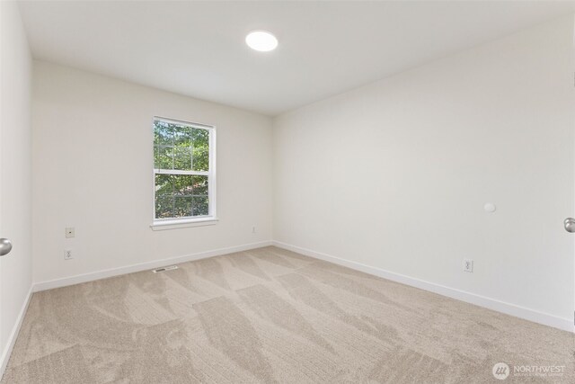 717 115th St E, Tacoma, WA 98445 - spare room featuring light carpet