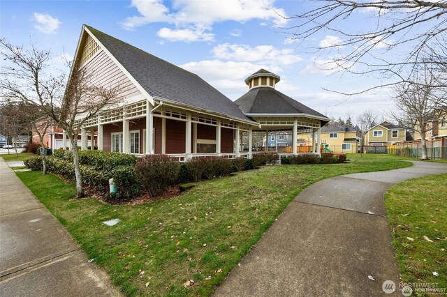 717 115th St E, Tacoma, WA 98445 - view of front of house featuring a porch and a shingled roof