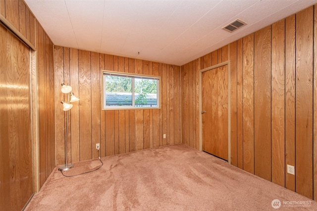 400 Gupster Unit 2, Sequim, WA 98382 - carpeted empty room with wooden walls