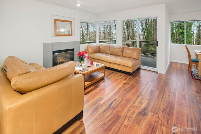 2367 S Forest St, Seattle, WA 98144 - living room with wood finished floors, a fireplace, baseboards, and recessed lighting