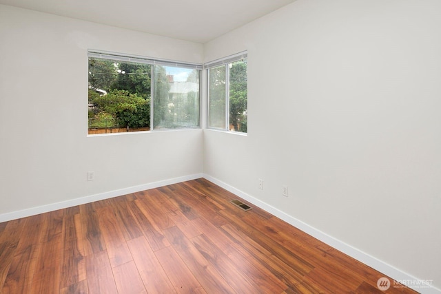 2367 S Forest St, Seattle, WA 98144 - spare room with baseboards and wood finished floors