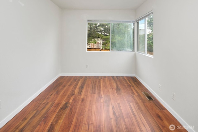 2367 S Forest St, Seattle, WA 98144 - spare room with wood finished floors and baseboards