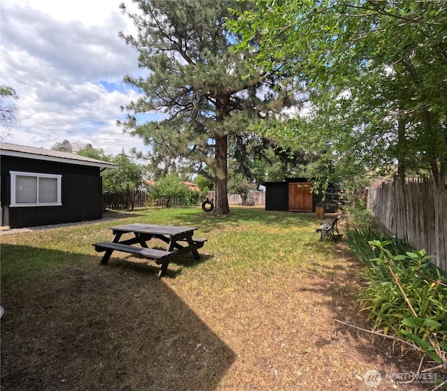 238 Castle Ave, Winthrop, WA 98862 - fenced backyard featuring a storage unit