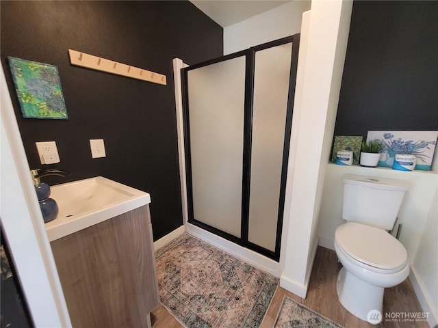 238 Castle Ave, Winthrop, WA 98862 - full bath featuring vanity, a stall shower, and wood finished floors