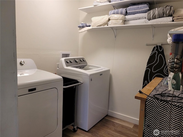 238 Castle Ave, Winthrop, WA 98862 - laundry room featuring washing machine and dryer and wood finished floors
