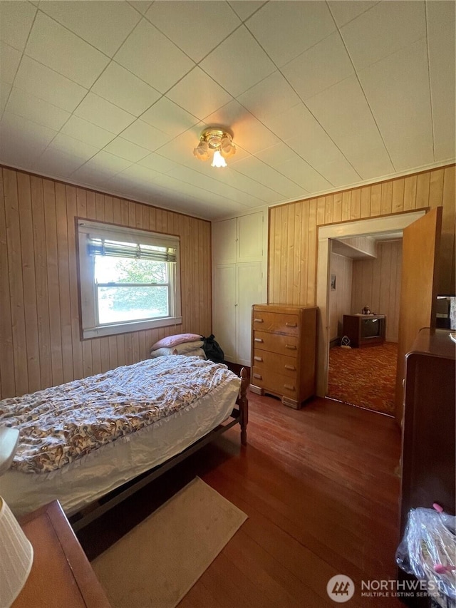 1204 Howard St, Raymond, WA 98577 - bedroom featuring wood finished floors and wood walls