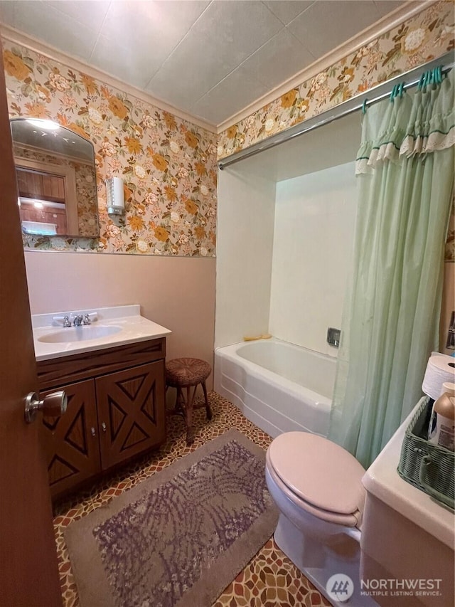 1204 Howard St, Raymond, WA 98577 - full bath with wallpapered walls, a wainscoted wall, toilet, vanity, and shower / tub combo with curtain