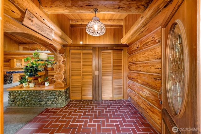 1416 Marietta Ave, Bellingham, WA 98226 - foyer with wood ceiling with exposed beams, brick patterned floors, and rustic walls