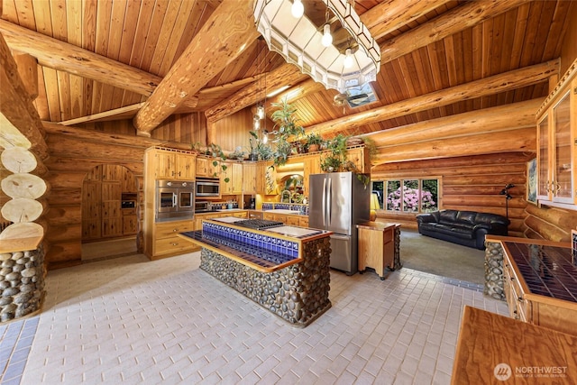 1416 Marietta Ave, Bellingham, WA 98226 - kitchen with stainless steel appliances, rustic walls, wooden ceiling, tile counters, and open floor plan