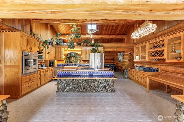 1416 Marietta Ave, Bellingham, WA 98226 - kitchen featuring log walls, stainless steel appliances, wooden ceiling, a sink, and glass insert cabinets