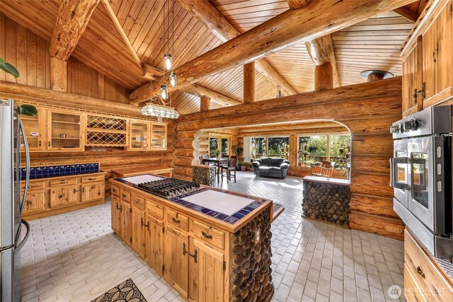 1416 Marietta Ave, Bellingham, WA 98226 - kitchen with wooden ceiling, log walls, appliances with stainless steel finishes, open floor plan, and glass insert cabinets