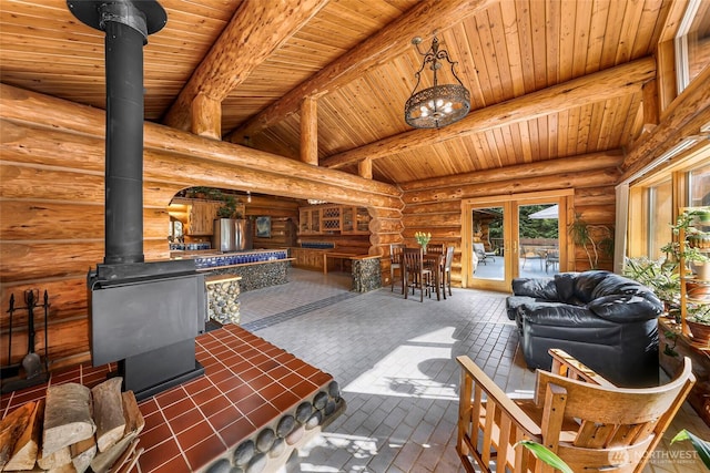 1416 Marietta Ave, Bellingham, WA 98226 - living area with wood ceiling, a wood stove, and log walls