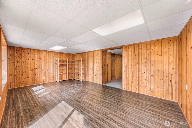 1416 Marietta Ave, Bellingham, WA 98226 - empty room with wooden walls, wood finished floors, and a drop ceiling
