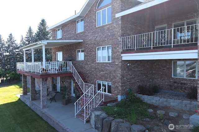 440 W Line Rd, Ephrata, WA 98823 - rear view of property with a patio area, brick siding, and stairway