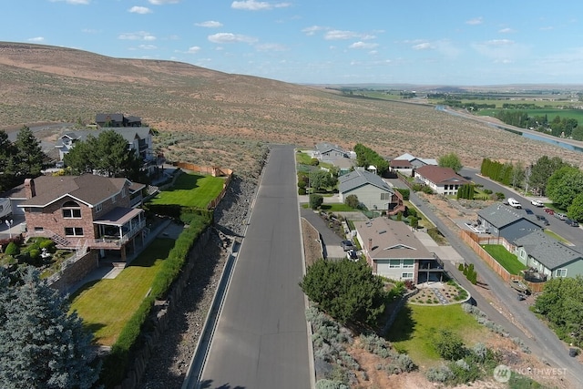 440 W Line Rd, Ephrata, WA 98823 - aerial overview of property's location featuring nearby suburban area and a mountainous background