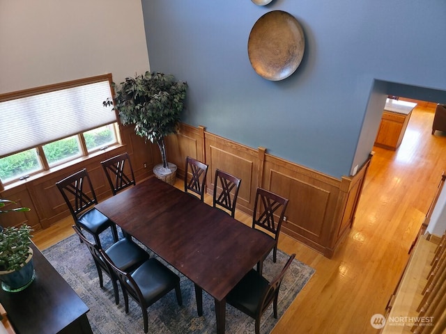 440 W Line Rd, Ephrata, WA 98823 - dining space featuring light wood-style flooring, wainscoting, and a decorative wall