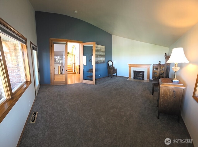 440 W Line Rd, Ephrata, WA 98823 - carpeted living area featuring vaulted ceiling and a fireplace with flush hearth