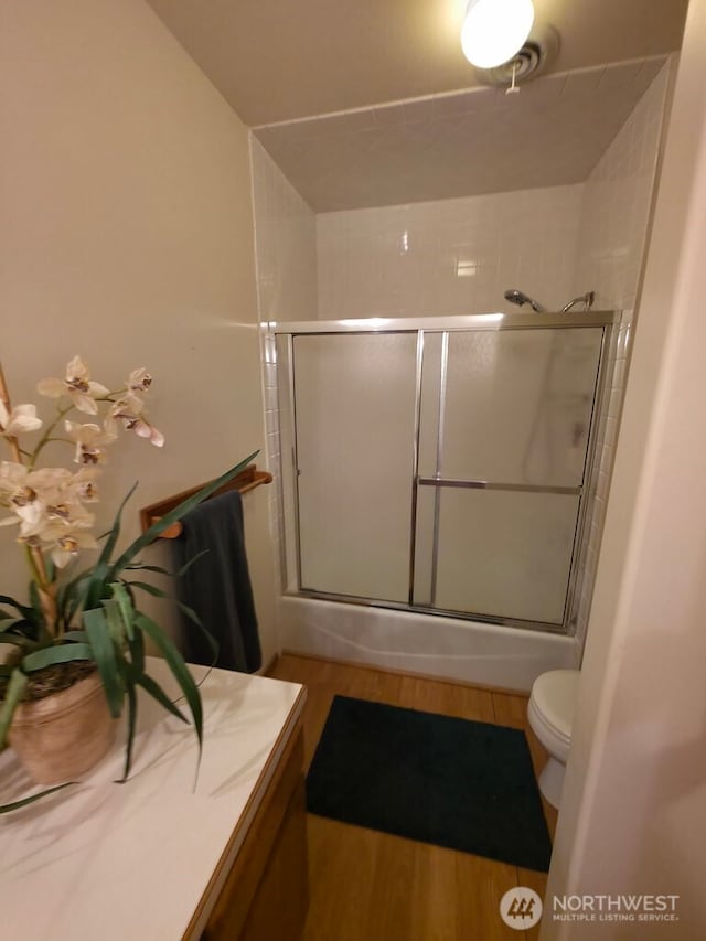 440 W Line Rd, Ephrata, WA 98823 - full bath with wood finished floors, toilet, bath / shower combo with glass door, and vanity