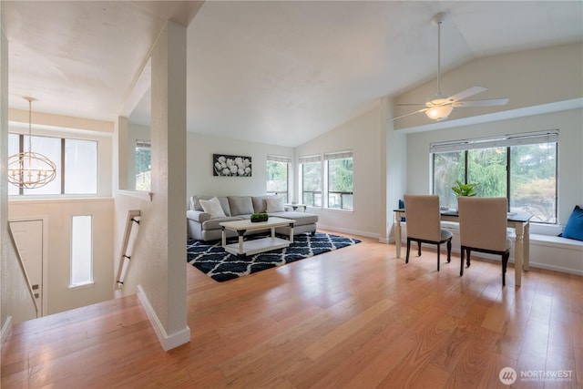 7309 46th Street Ct W, University Place, WA 98466 - foyer featuring lofted ceiling, a chandelier, wood finished floors, and ceiling fan