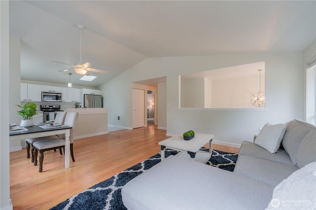 7309 46th Street Ct W, University Place, WA 98466 - living area featuring a ceiling fan, light wood-type flooring, vaulted ceiling, and a chandelier