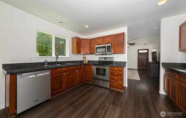 10312 26th Pl SE, Lake Stevens, WA 98258 - kitchen with stainless steel appliances, dark wood-type flooring, recessed lighting, dark countertops, and a ceiling fan
