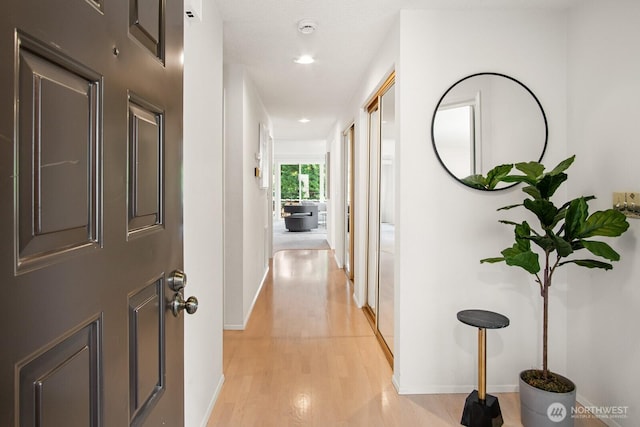 16929 Inglewood Rd NE Unit C201, Kenmore, WA 98028 - corridor with baseboards, light wood finished floors, and recessed lighting