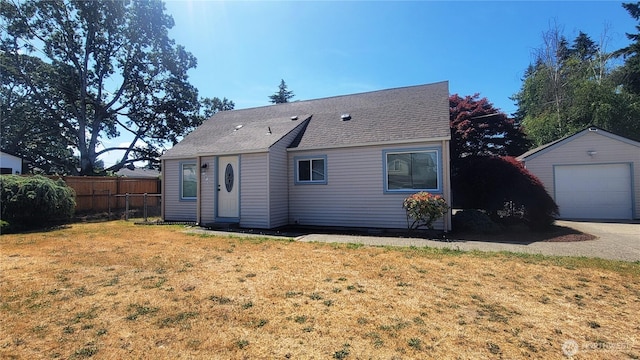 1618 112th St S, Parkland, WA 98444 - back of house featuring an outdoor structure, a garage, roof with shingles, and concrete driveway