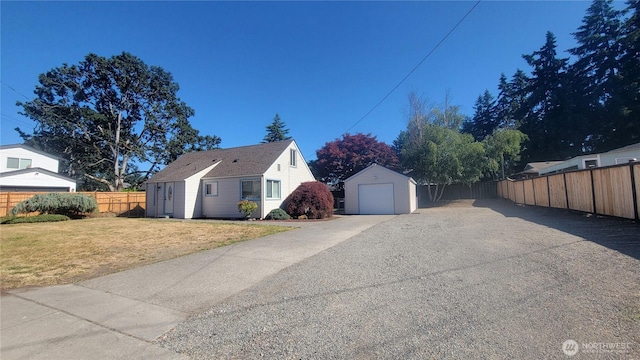 1618 112th St S, Parkland, WA 98444 - view of home's exterior featuring a garage, an outbuilding, and driveway