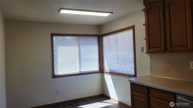 1618 112th St S, Parkland, WA 98444 - unfurnished dining area featuring baseboards