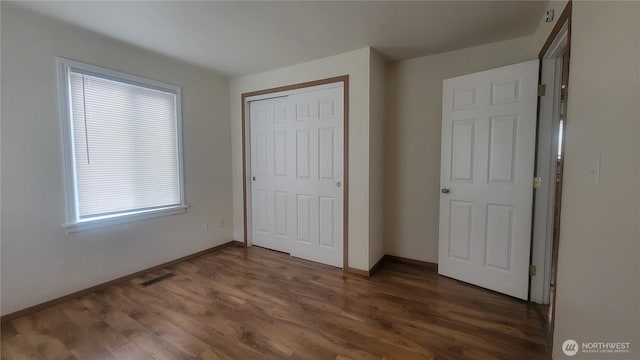 1618 112th St S, Parkland, WA 98444 - unfurnished bedroom featuring a closet and wood finished floors